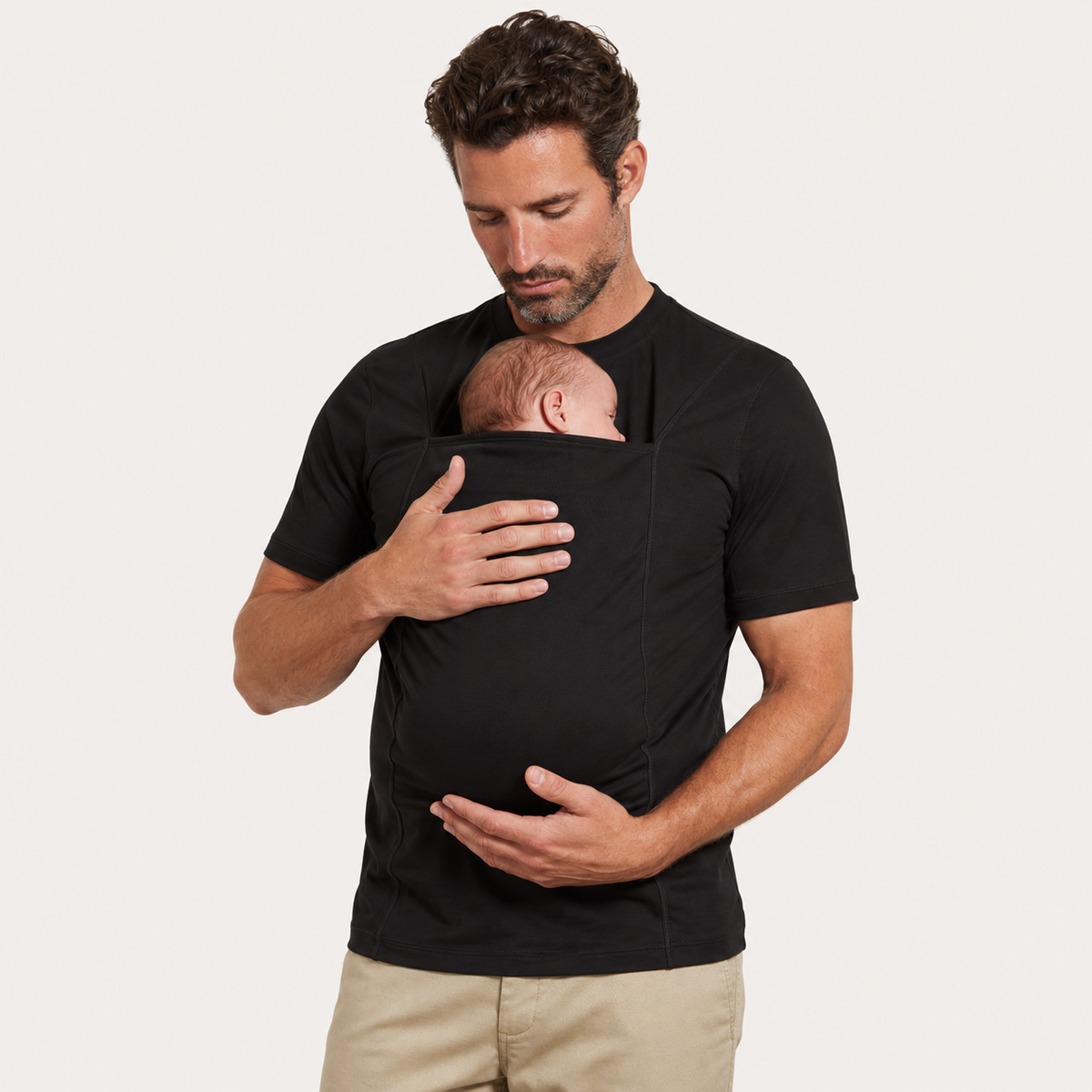 The Close Tee in Black, worn with a baby in the kangaroo pouch